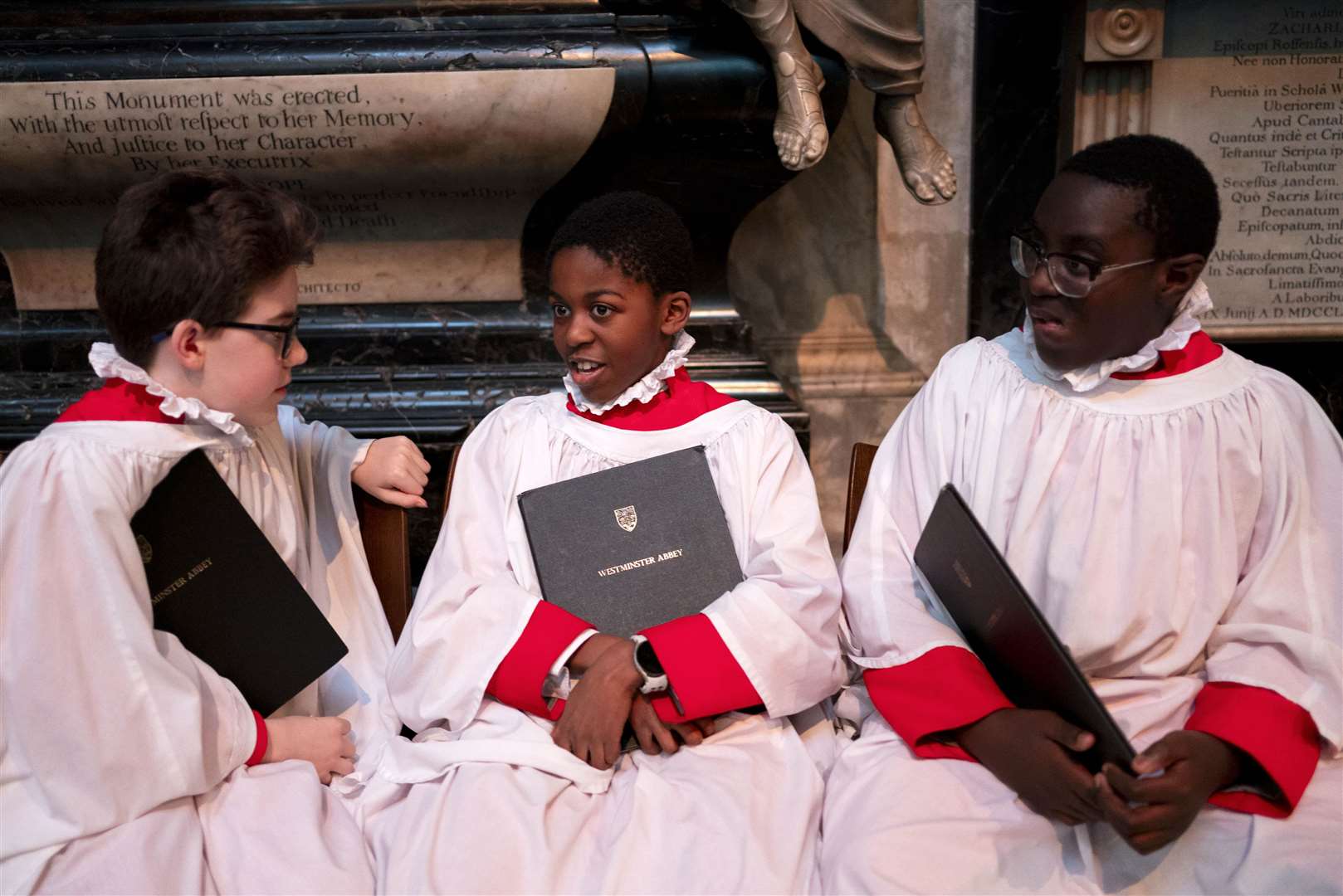 Boy choristers chat before the service ((Jordan Pettitt/PA)