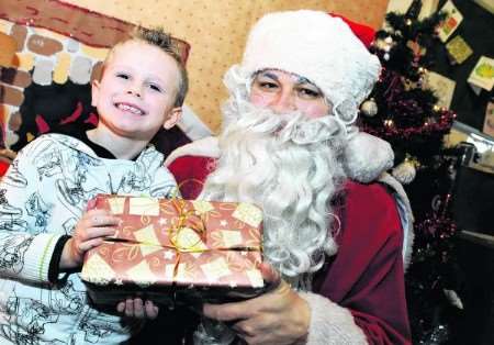 Harrison Trennery, five, meets Santa