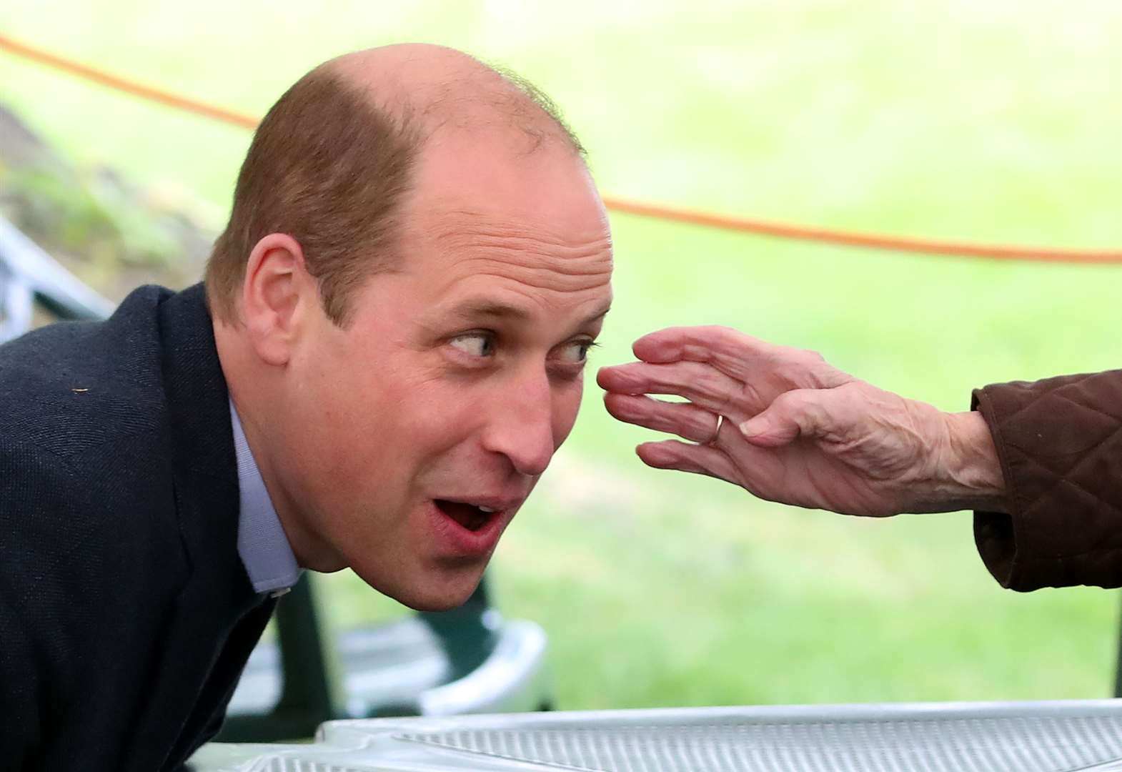 The outstretched hand of resident Betty Magee, 96, touched William face with he visited the Queen’s Bay Lodge Care Home in Edinburgh earlier this week (Andrew Milligan/PA)