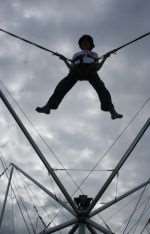 Young visitors fly high above Palm Bay on this reverse bungee ride at Margate's Big Event