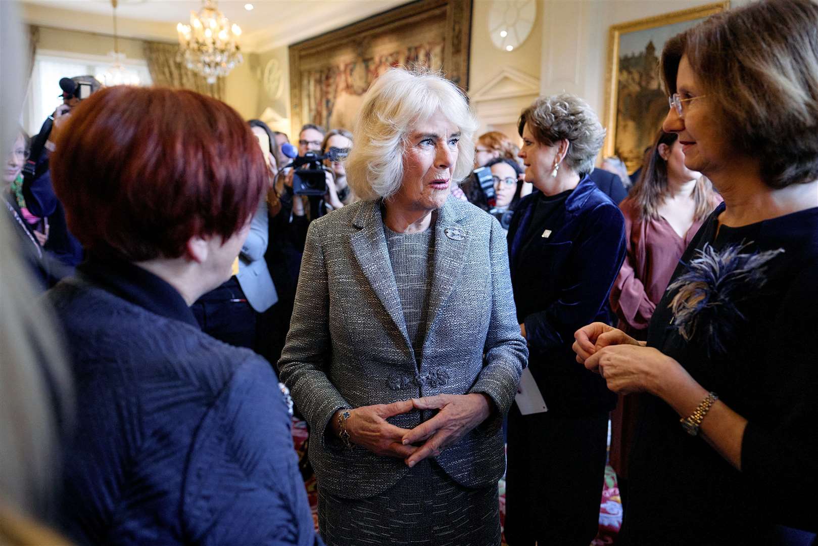 The Queen speaks to guests at the reception (Benjamin Cremel/PA)