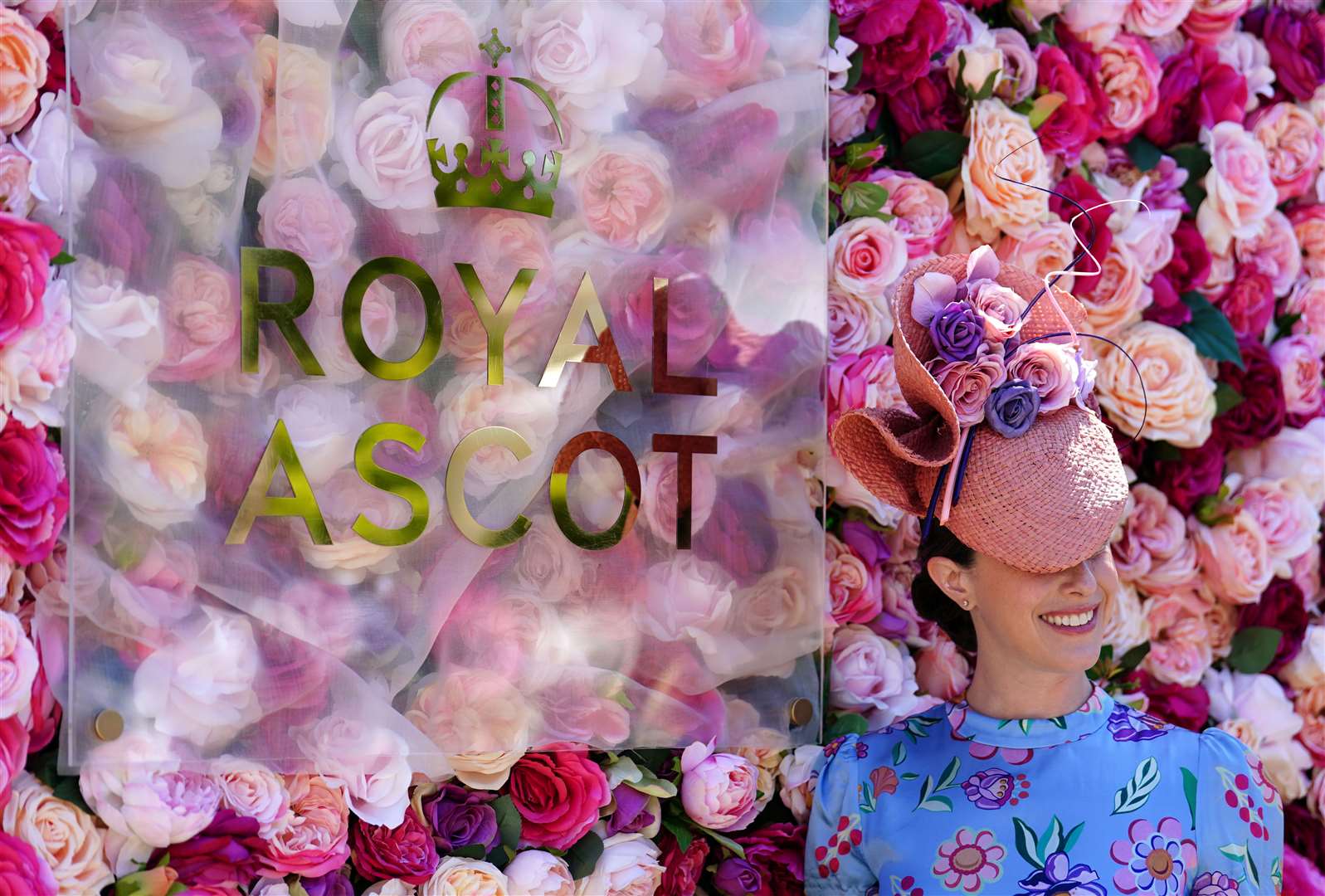 A racegoer poses for a photograph ahead of day one of Royal Ascot (David Davies/PA)