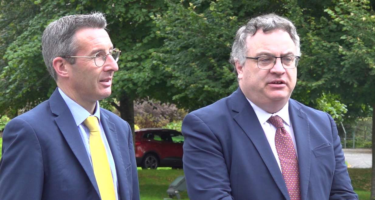 Alliance Party deputy leader Stephen Farry (right) with party colleague Andrew Muir, said NI was facing its most serious situation for 25 years (Jonathan McCambridge/PA)