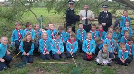 Ch Insp Peter Wedlake and PC Ann Jeffery with members of the 2nd Cliffe Scout group, including Scout leader Shaun Clark