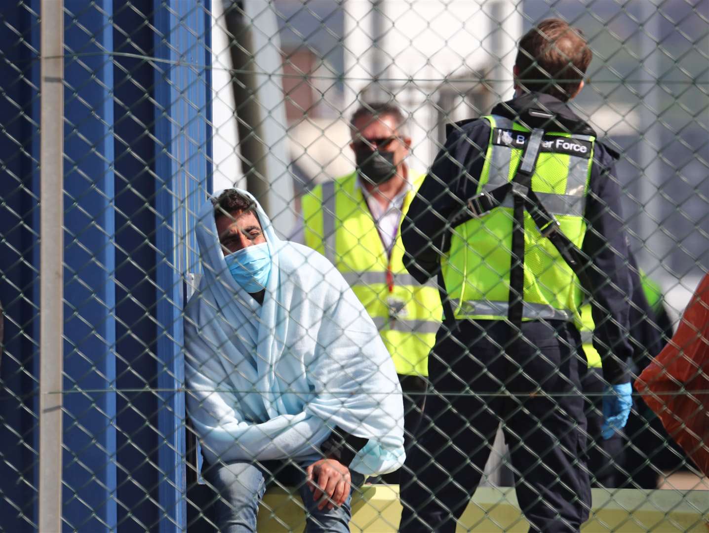 A man thought to be a migrant is processed by Border Force officers after being brought to shore in Dover, Kent, following small boat incidents in The Channel last weekend (Gareth Fuller/PA)