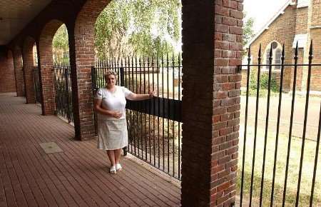 Biffy Roche of MeRGE inside the railings behind her office. Picture: JIM RANTELL