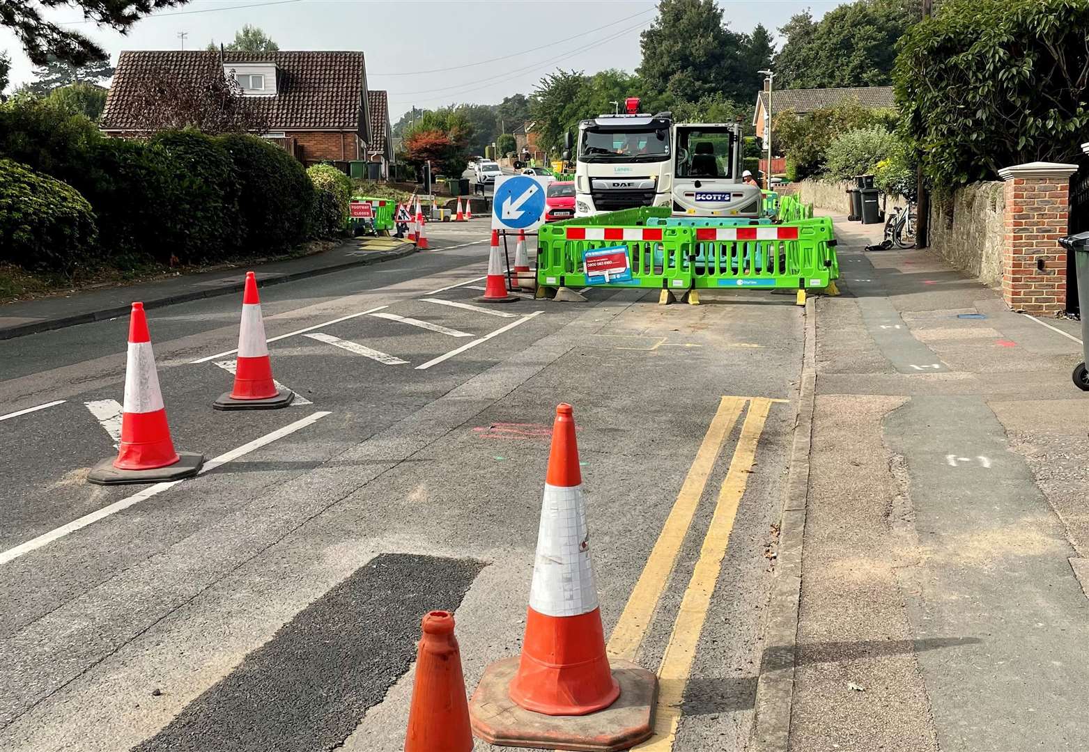 A trench restored as work is put on hold