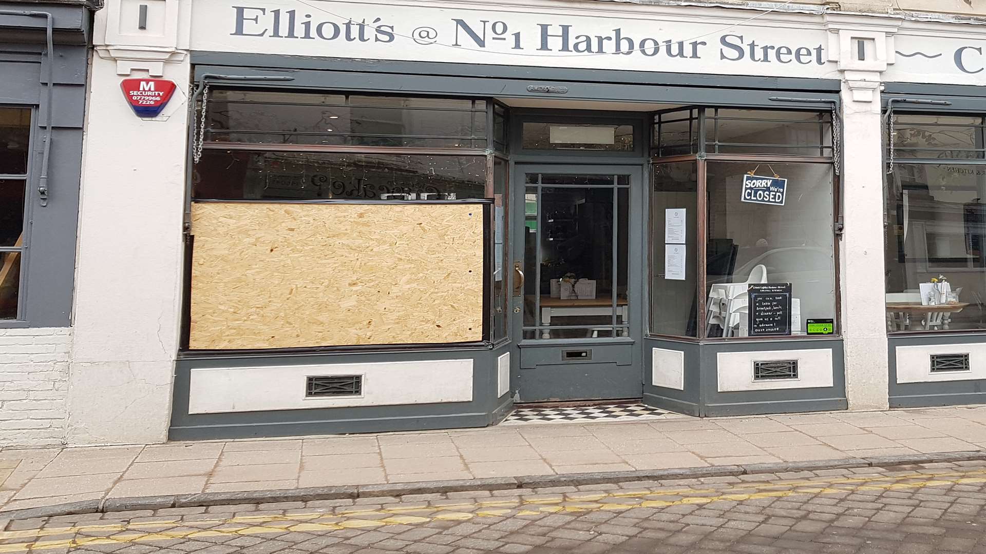 The window of Elliott's was boarded up