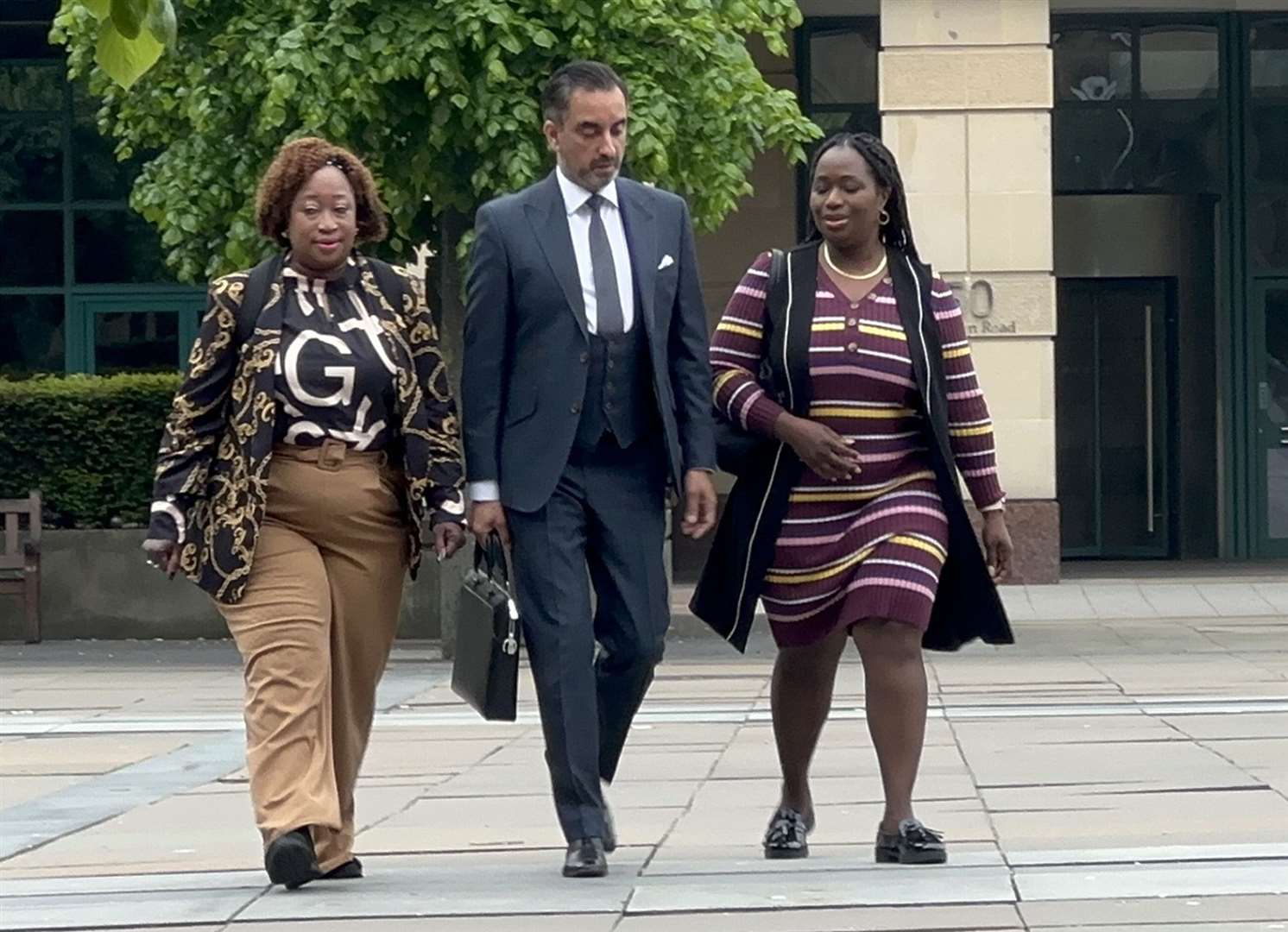 Solicitor Aamer Anwar, centre, with Sheku Bayoh’s family (Dan Barker/PA)