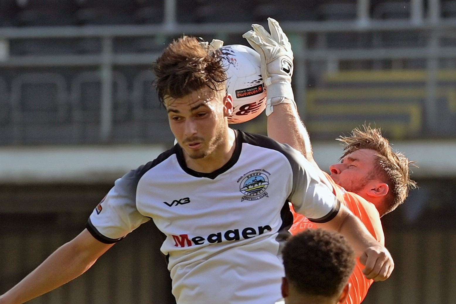 Striker George Nikaj fails to head the ball ahead of the Weymouth goalkeeper. Picture: Stuart Brock