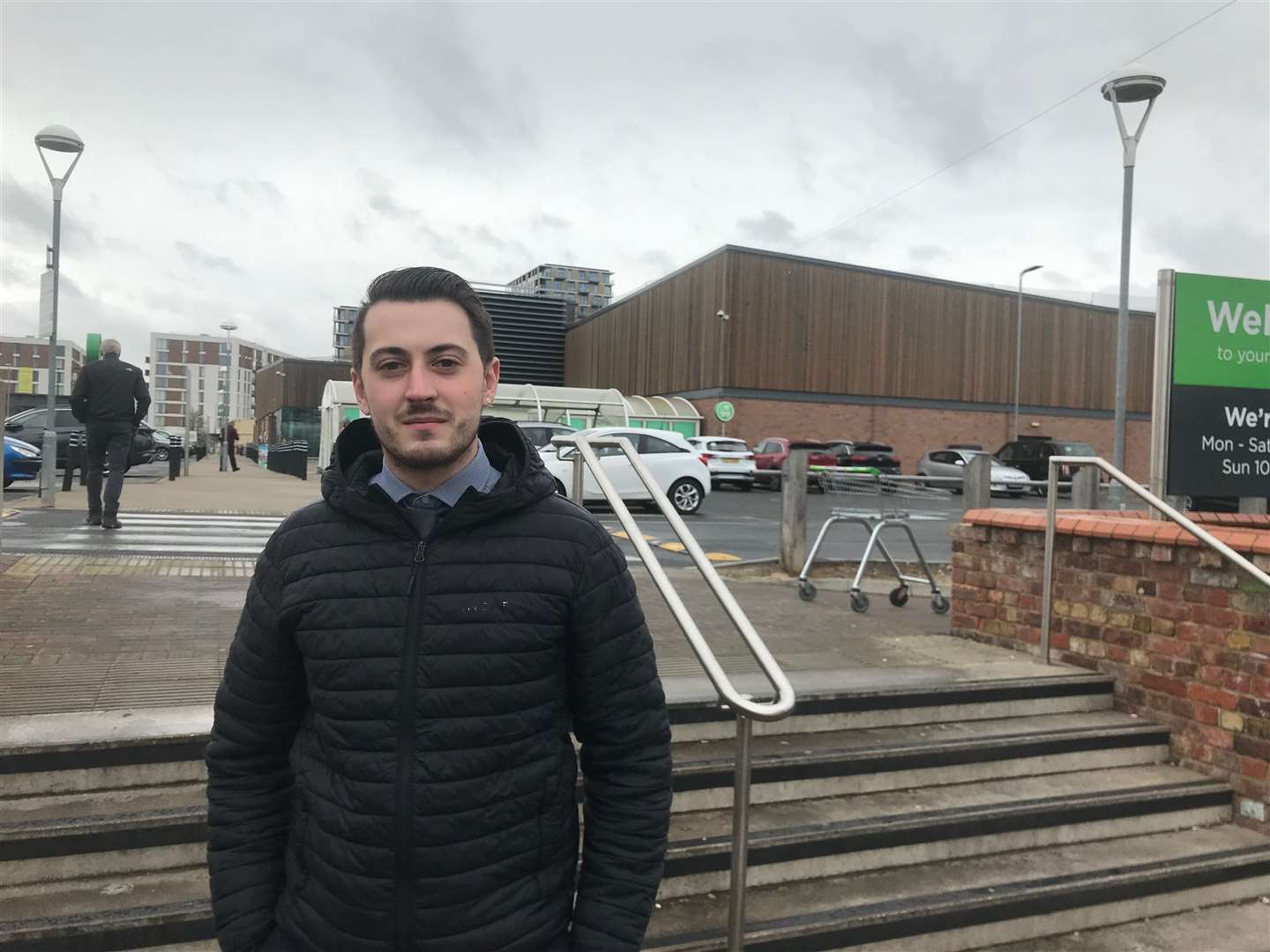 Electric car owner Lewis Fox at Asda in Gillingham