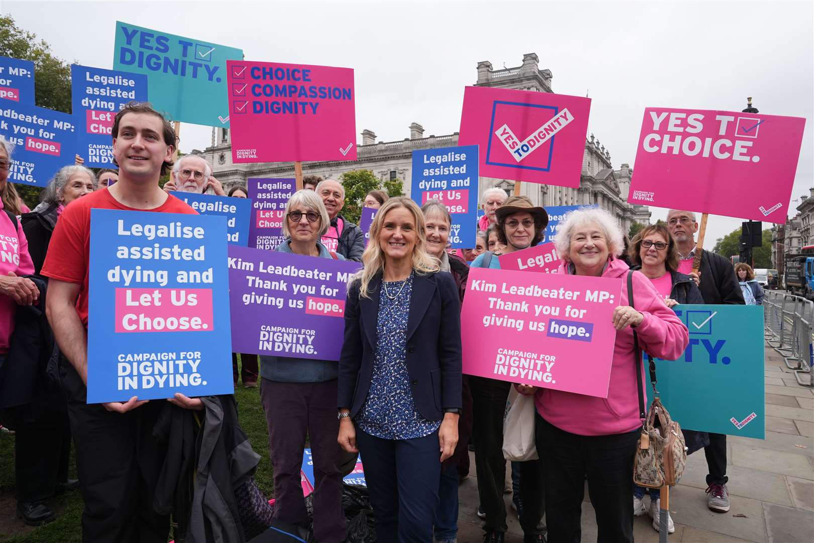 Labour MP Kim Leadbeater (centre) joins as Dignity in Dying campaigners gather in Parliament Square, central London, in support of the assisted dying Bill (PA)