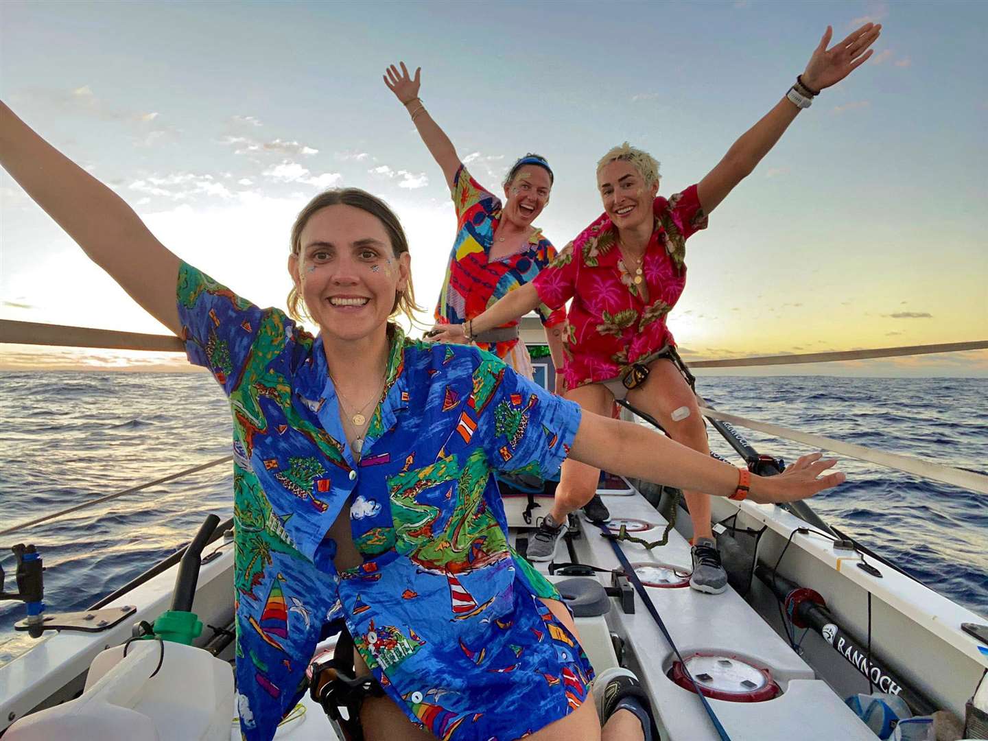 Rowers (front to back) Charlotte Irving, Kat Cordiner and Abby Johnston, on their way to shatter the world record for rowing across the Atlantic. Cancer Research UK