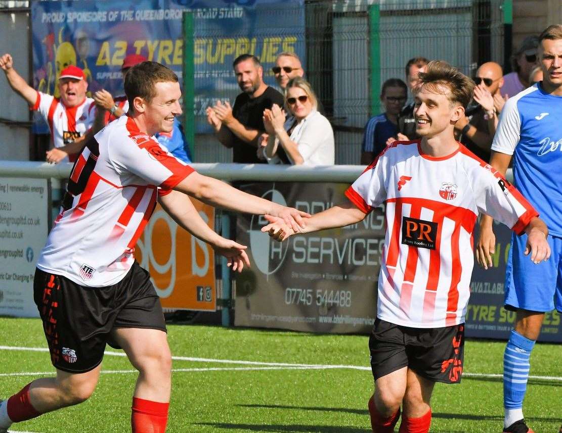 Jacob Lambert is congratulated by team-mate Josh Wisson after his second and Sheppey's third of the afternoon in their 3-1 First Qualifying Round win over Kennington on Saturday. Picture: Marc Richards