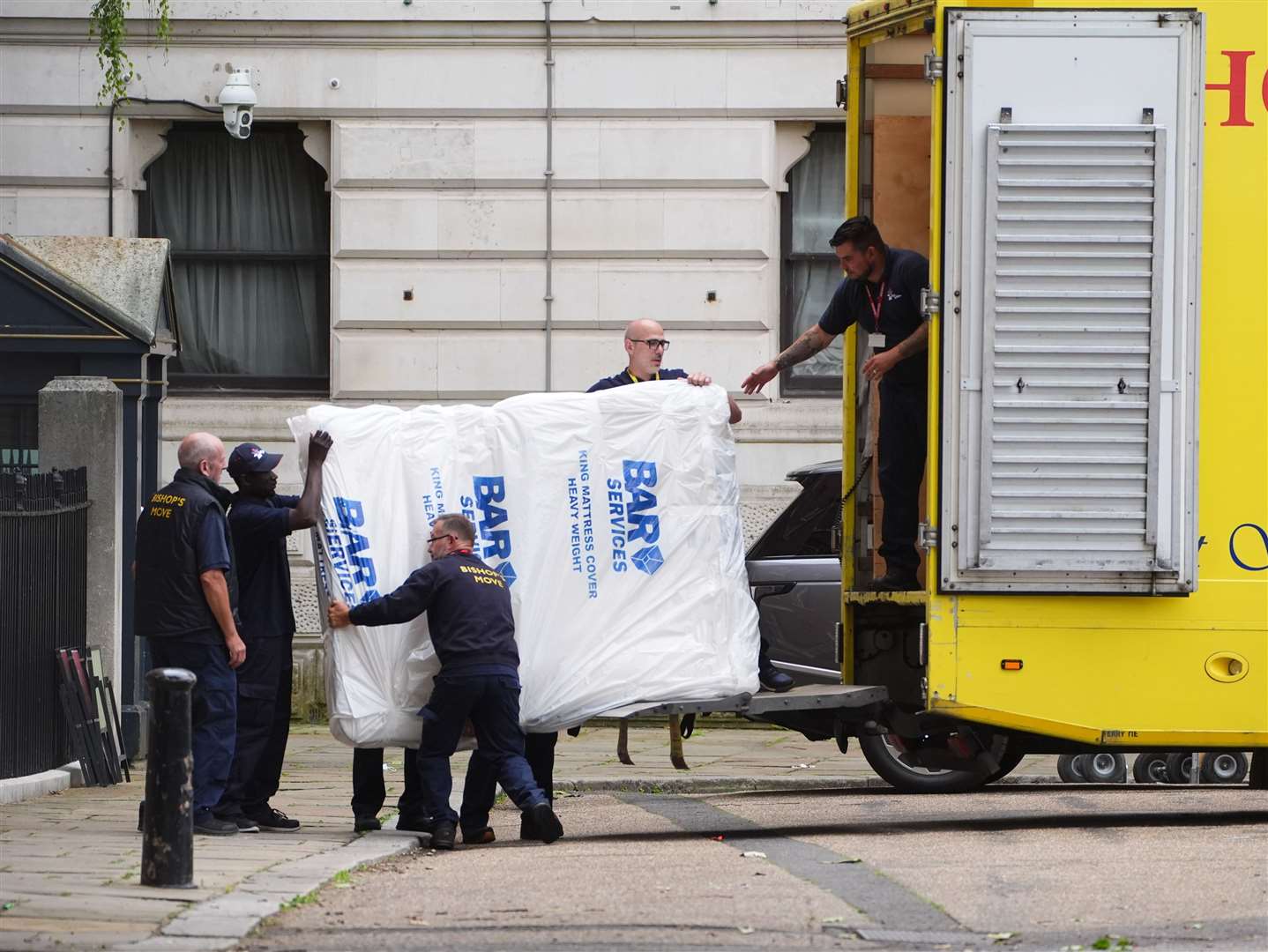 Removal men carrying a mattress out of Downing Street (James Manning/PA)