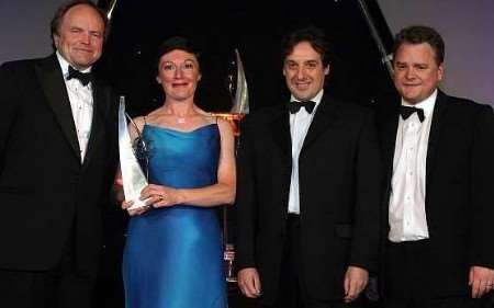 Margaret Connolly, tax partner at Reeves & Neylan, receives the award from special guest Clive Anderson (left). Picture courtesy: ANDREW DUNSMORE/Picture Partnership