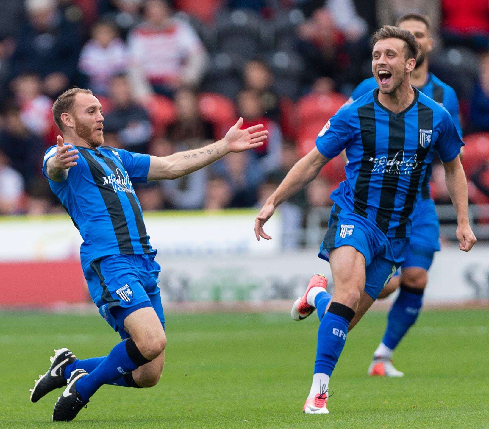 Gillingham's Barry Fuller celebrates scoring the opening goal at Doncaster. Picture: Ady Kerry