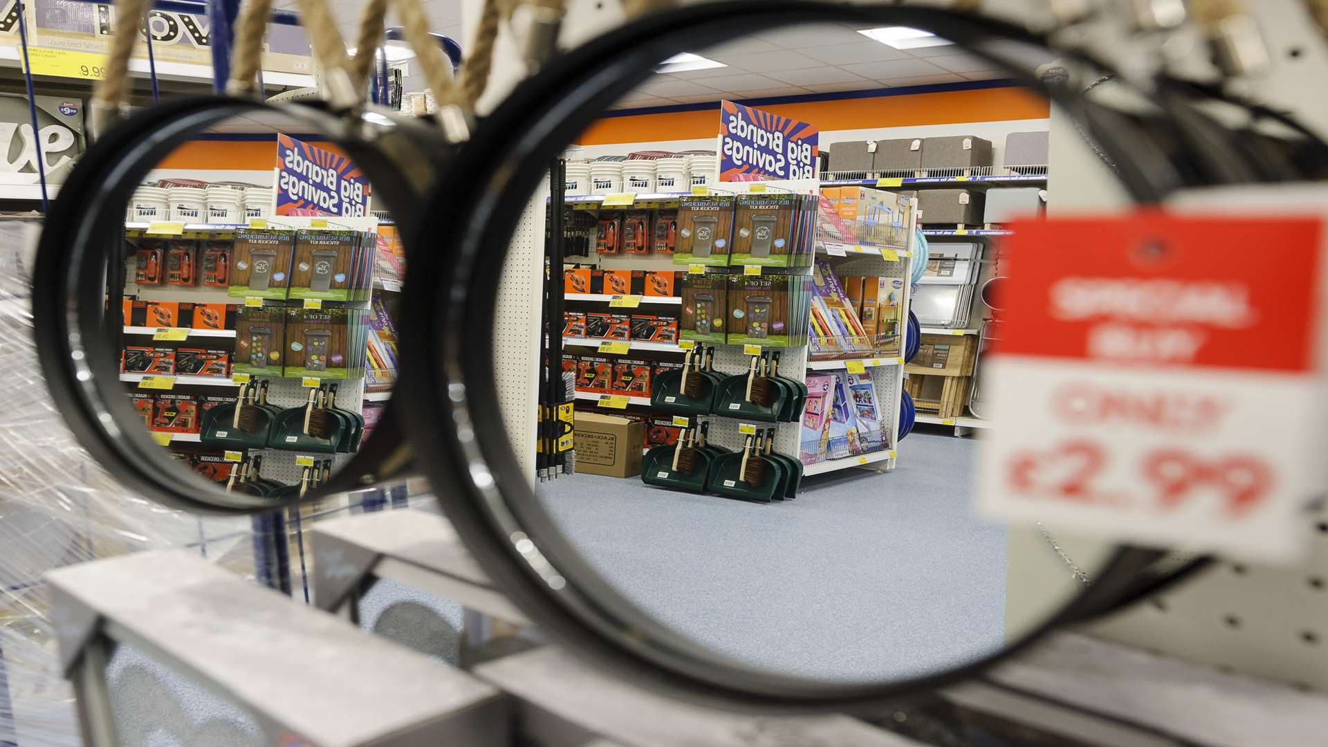 Inside the store, with shelf-filling taking place in the widely-spaced aisles.