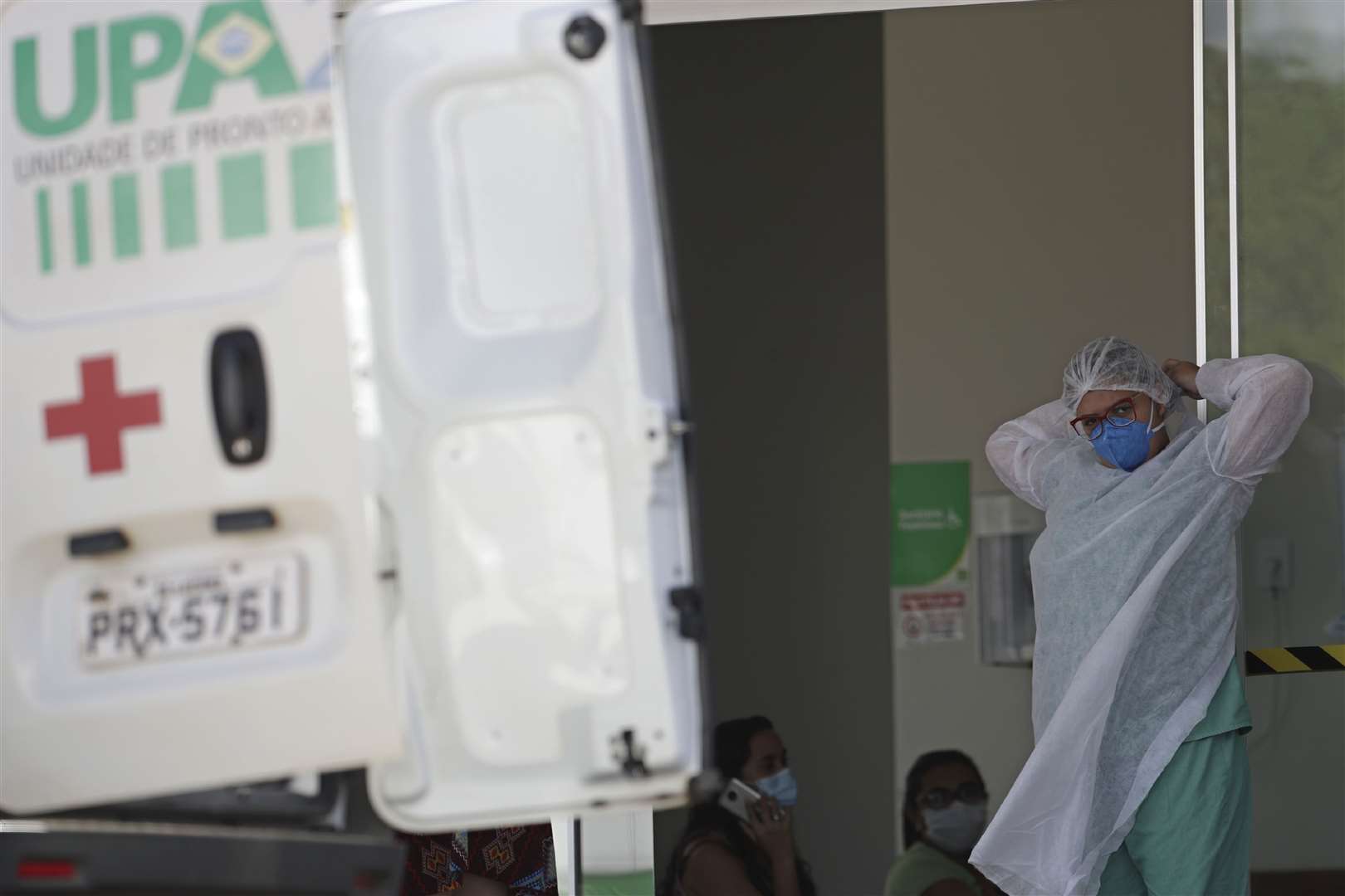 A health worker prepares to receive a Covid-19 patient in Brazil (AP)