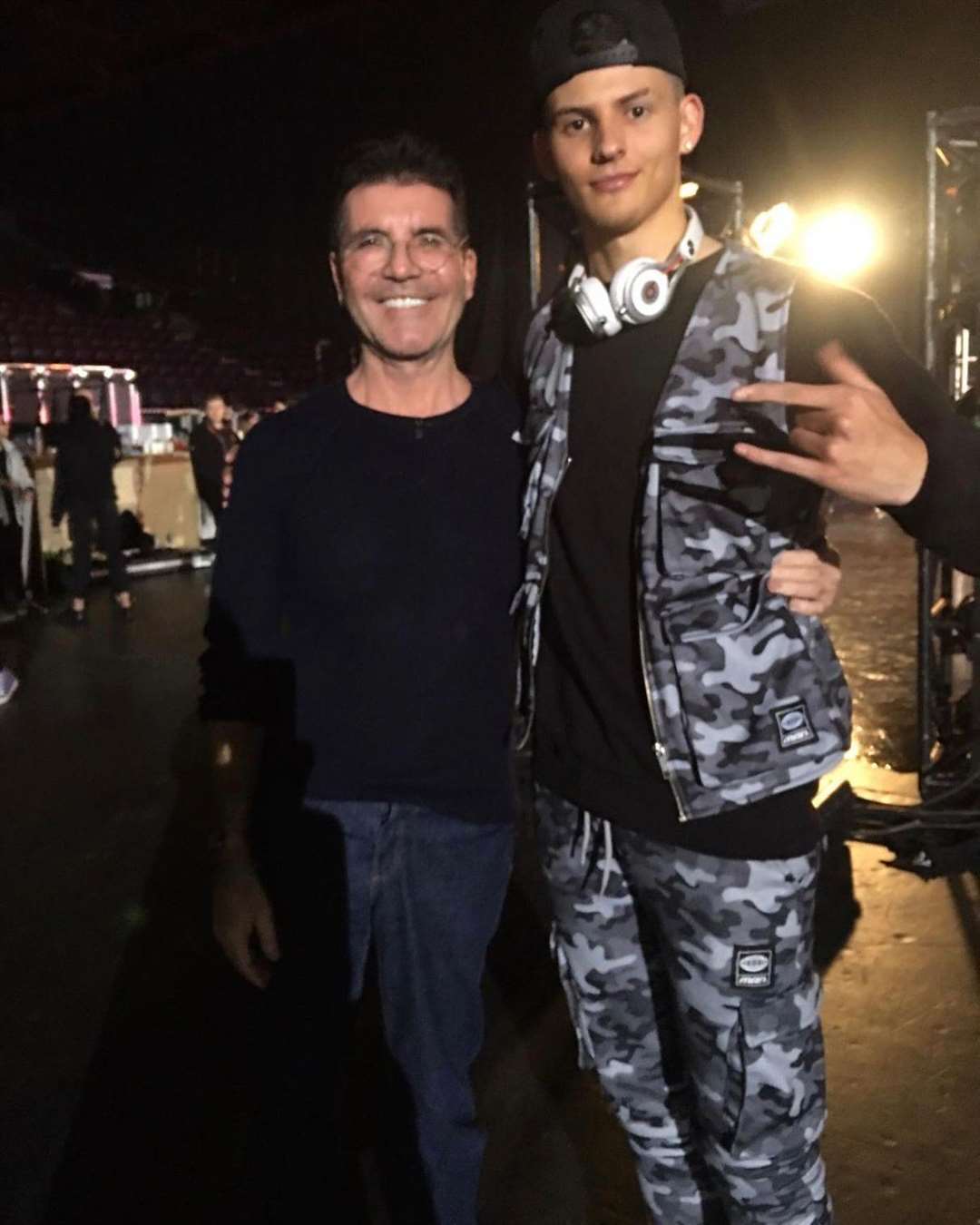Jus JayCee with Simon Cowell during his time on the X Factor
