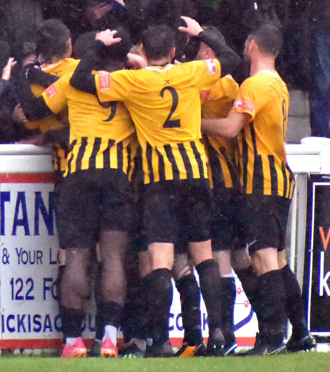 Folkestone's players celebrate Yusuff's goal - the only goal of the game - with their fans as they beat National League North Gloucester City 1-0. Picture: Randolph File