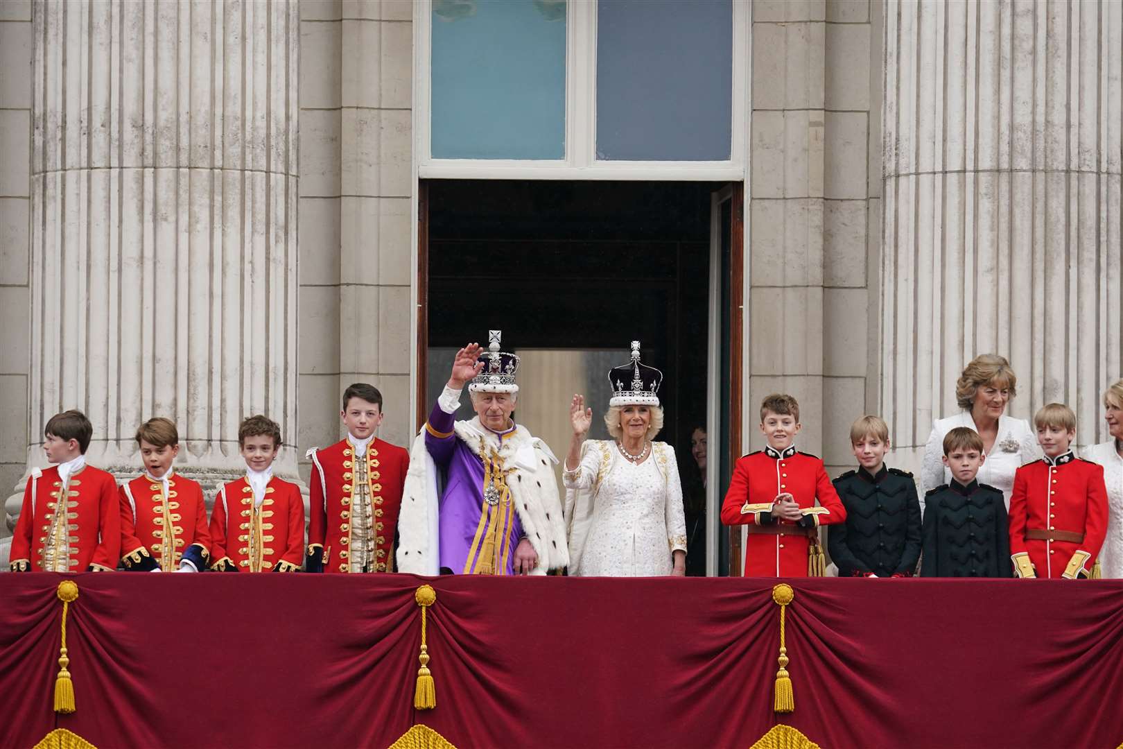 The King and Queen on the balcony of Buckingham Palace following the coronation (Owen Humphreys/PA)