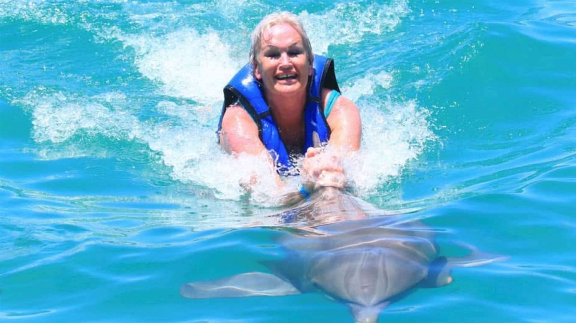 Despite battling cancer, Tanya Huckstep, of Herne Bay, was determined to cross swimming with dolphins off her bucket list. Picture: Natalie Reid