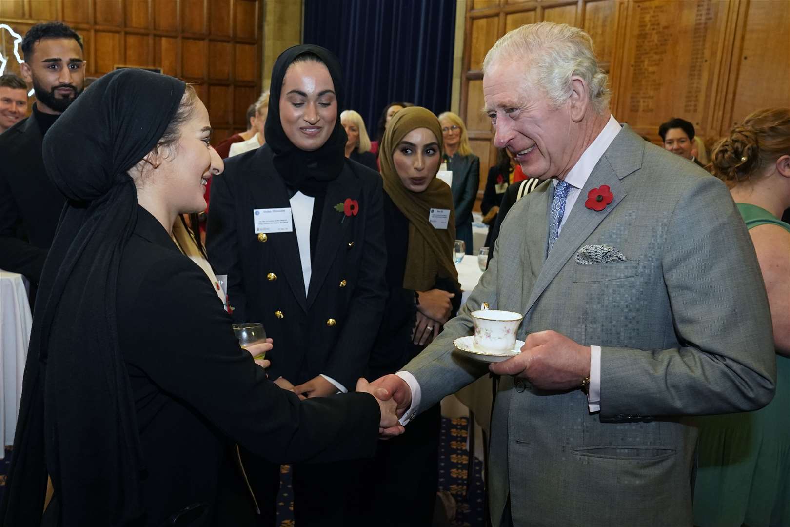 The King meets boxer Safiyyah Syeed at a reception with young leaders from across Bradford at Bradford City Hall (Danny Lawson/PA)