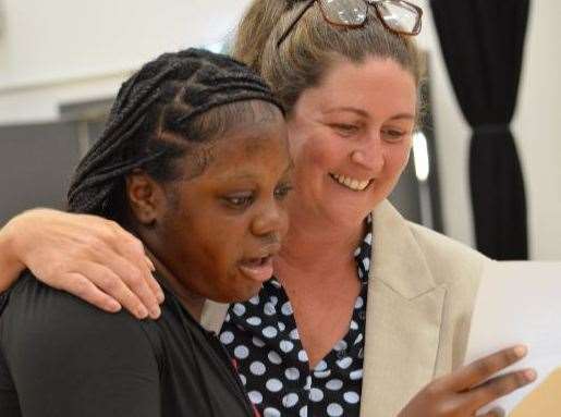 St John fisher pupil Rachael receiving her GCSE results with Mrs Drain