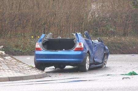 Firefighters cut the roof off the car after the crash in Canterbury city centre