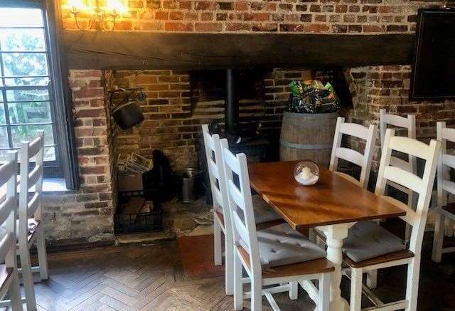 There is a good-sized inglenook fireplace in dining room on the left-hand side of the pub