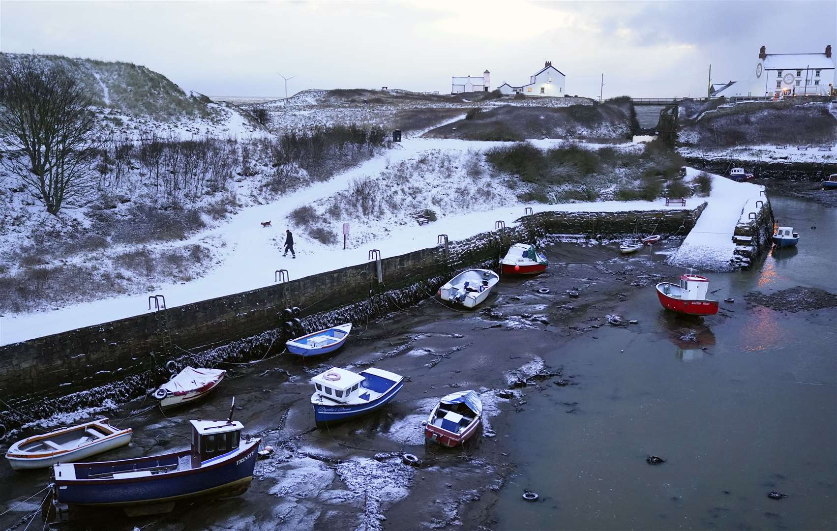 Snow dustings at Seaton Sluice Harbour in the North East (Owen Humphreys/PA)