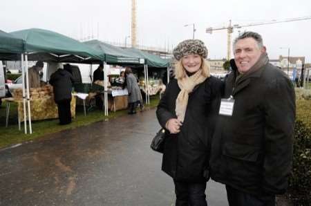 Braving the weather - June and Keith Chadband at the farmers' market