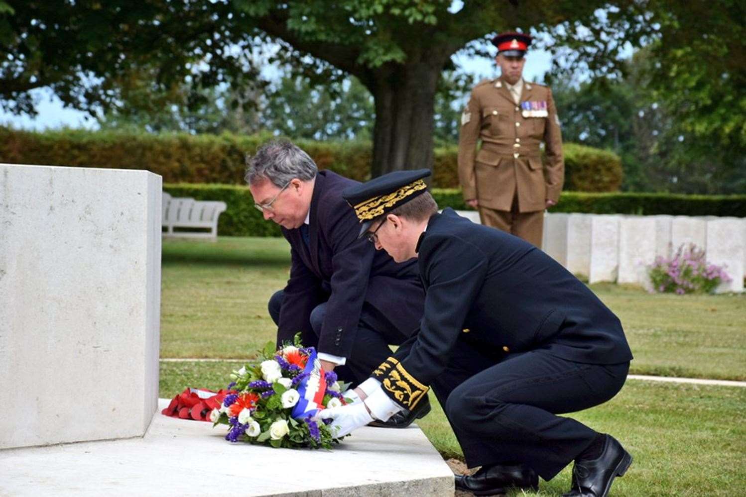 British Ambassador to France Edward Llewellyn lays a wreath during the ceremony (Prefecture du Calvados-BV/PA)