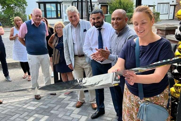 Owner Tariq Ahmed, second right, and his brother Jamil, third right, on opening day. Picture: Jamil Trofder