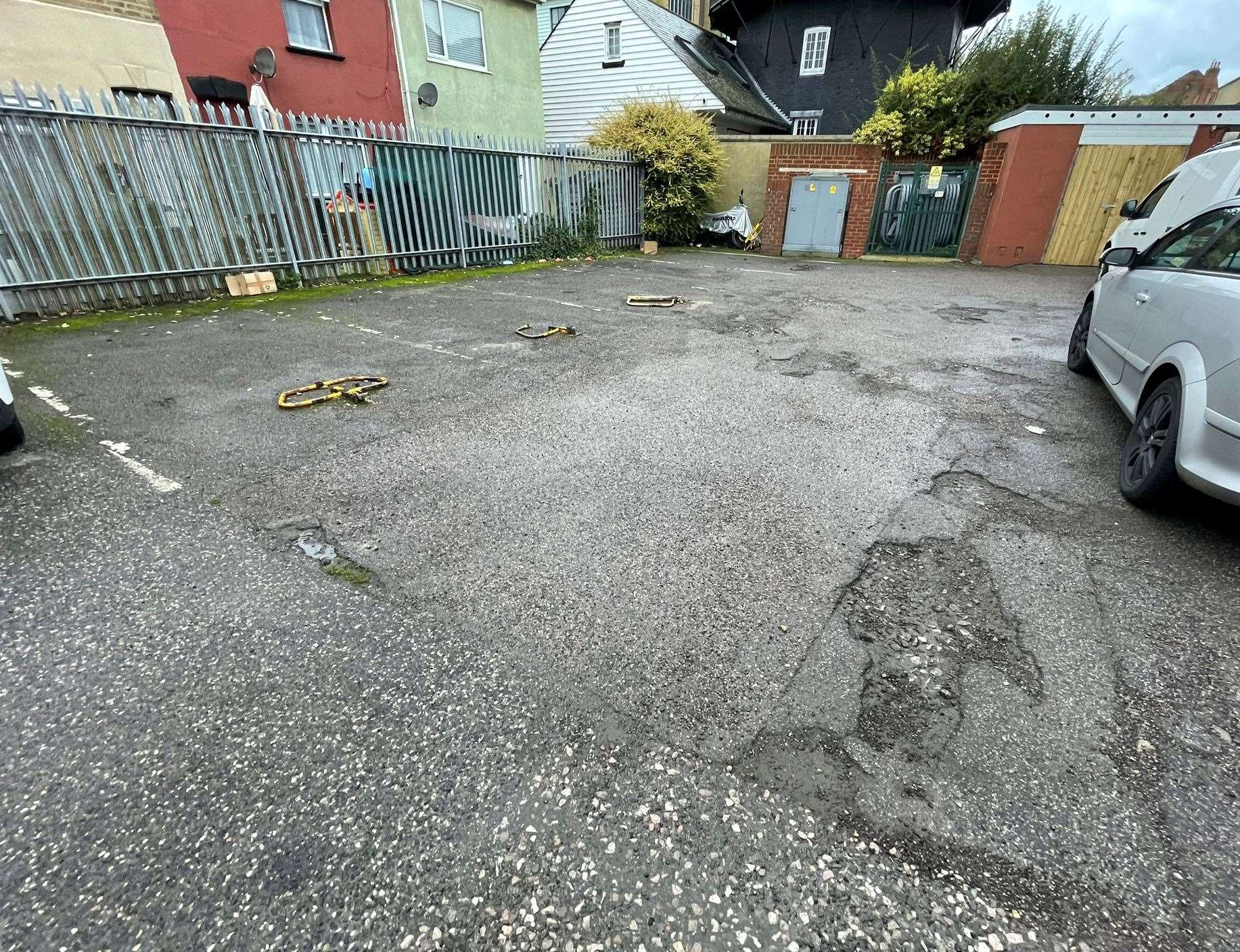 The car park behind Portland House in Sheerness was full of potholes. Picture: Joe Crossley