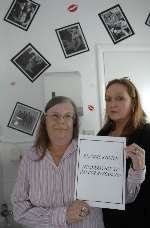 pub regular Celia Yeo and landlady Sarah Murton in the toilets of the Dog and Gun Pub