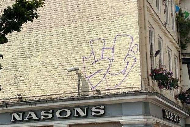 Taylor scrawled graffiti across the old Nasons building in Canterbury High Street. Picture: Canterbury City Council