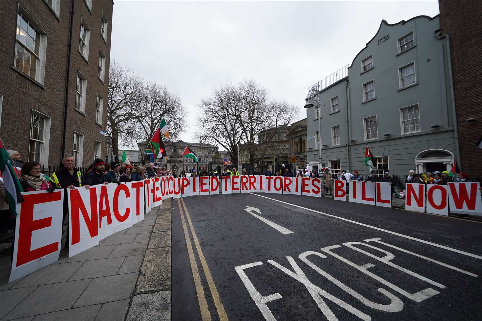 Protesters gathered outside Leinster House in Dublin ahead of the first sitting of the new Dail (Brian Lawless/PA)