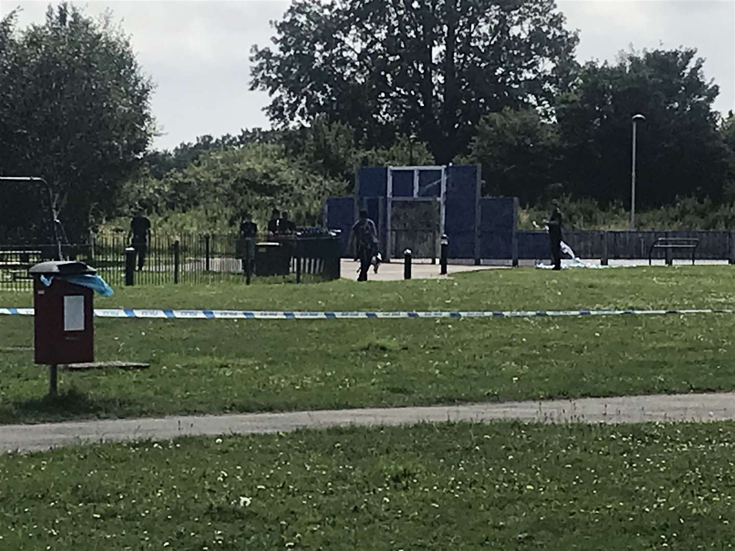 Police, some with dogs, are searching a play park this morning, near where a teen was attacked