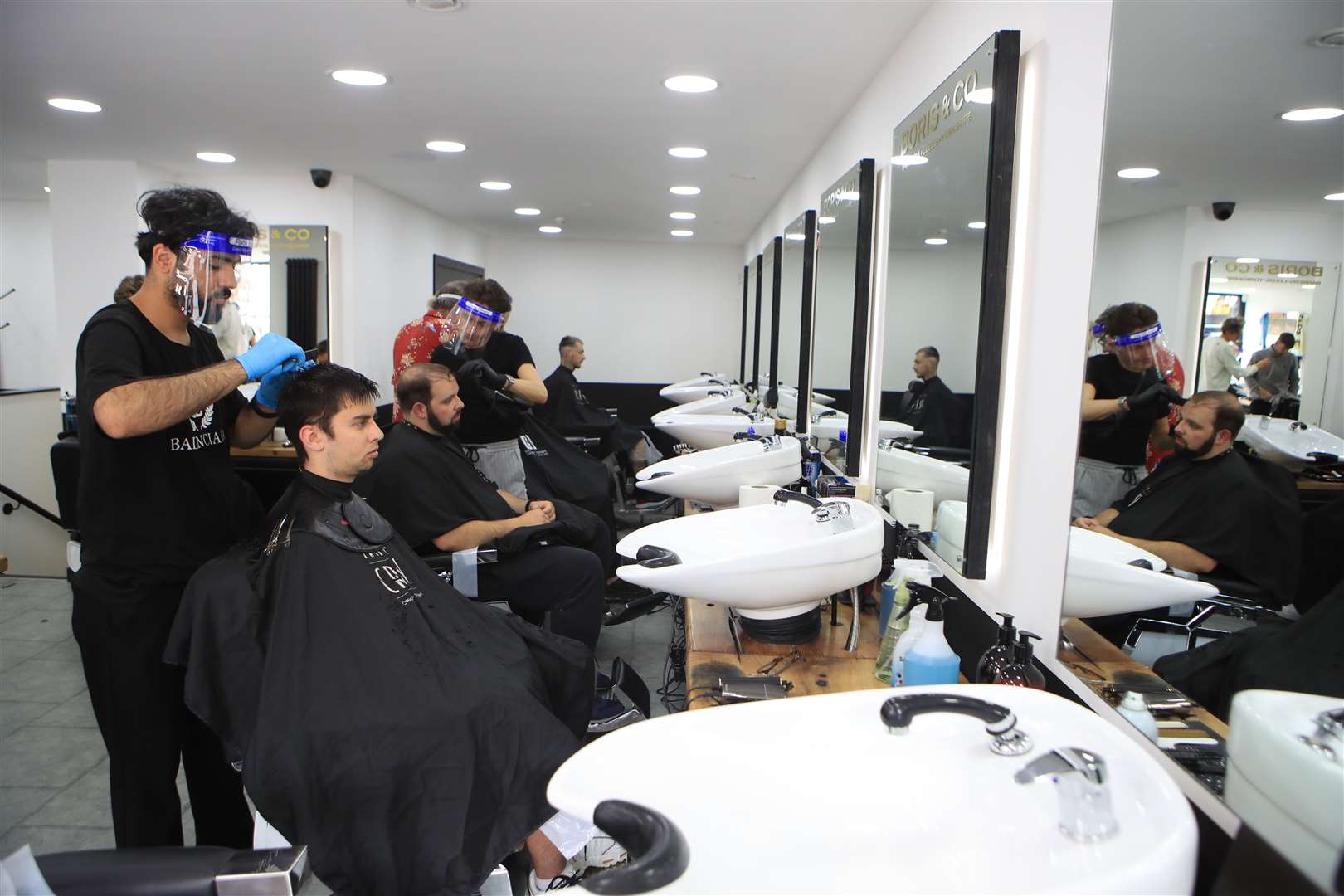 In Leeds, barbers at Boris & Co were busy on their first day back at work (Danny Lawson/PA)