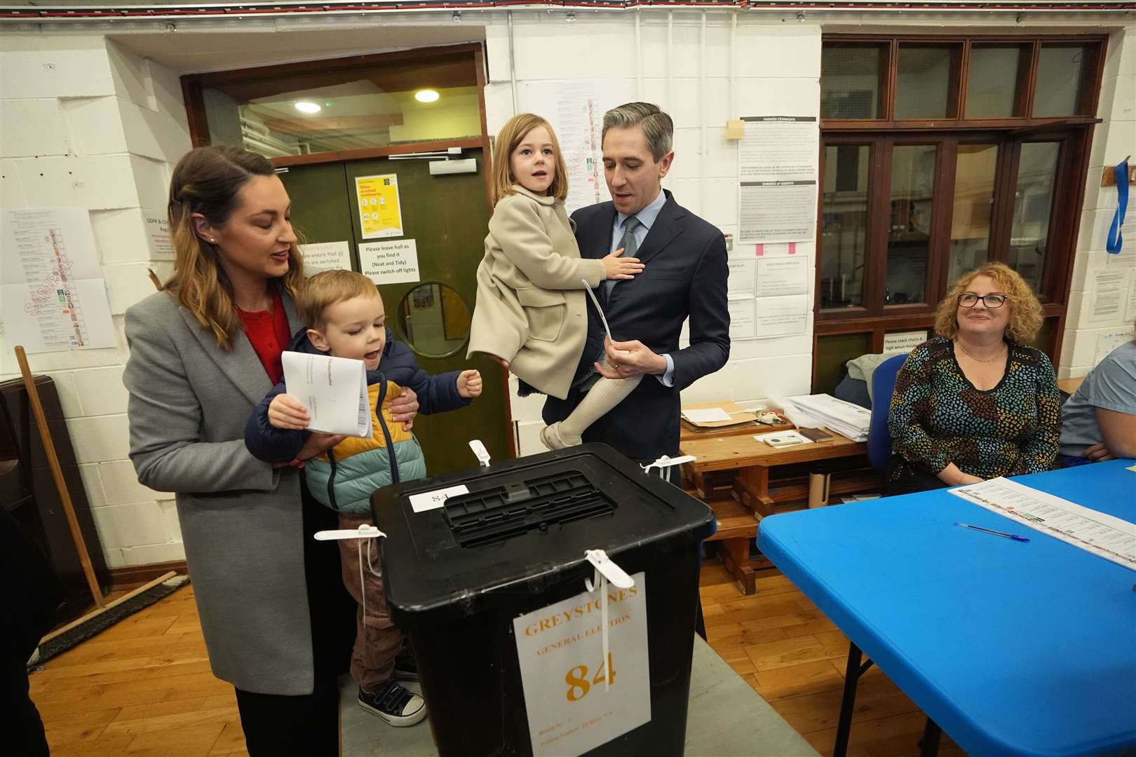 Taoiseach and Fine Gael leader Simon Harris accompanied by his wife Caoimhe and children Cillian and Saoirse as he casts his vote at Delgany National School, Co Wicklow (Niall Carson/PA)