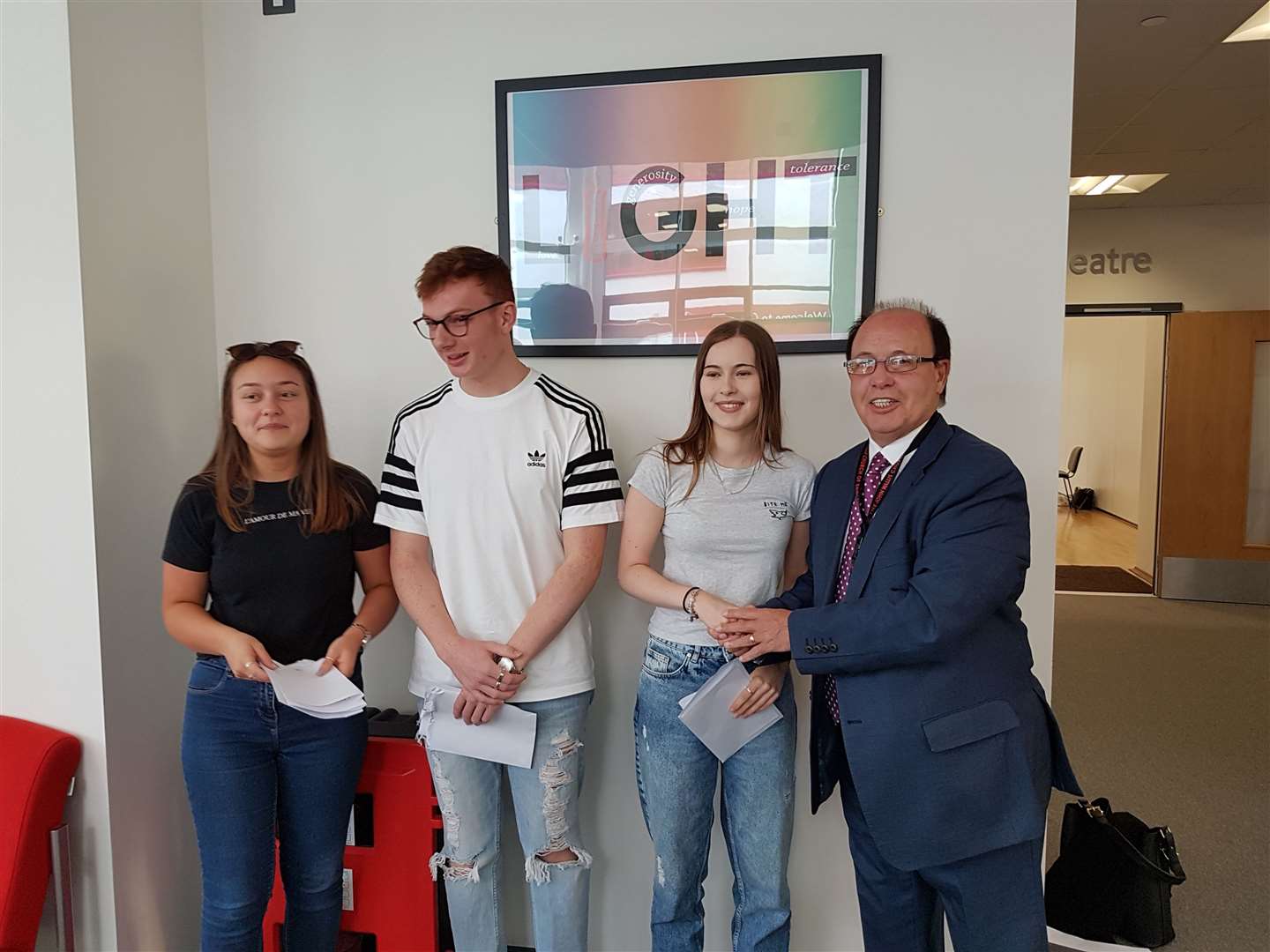 Mr McParland alongside (right to left) the school's head girl Ellen O'Keefe, head boy Joshua Churm, and deputy head girl Holly Prue. (15281544)