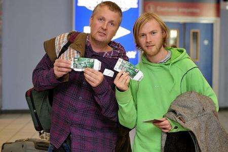 Father and son, John and John Baker, from Folkestone arrive at Luton Airport aftering retuning from Poland.