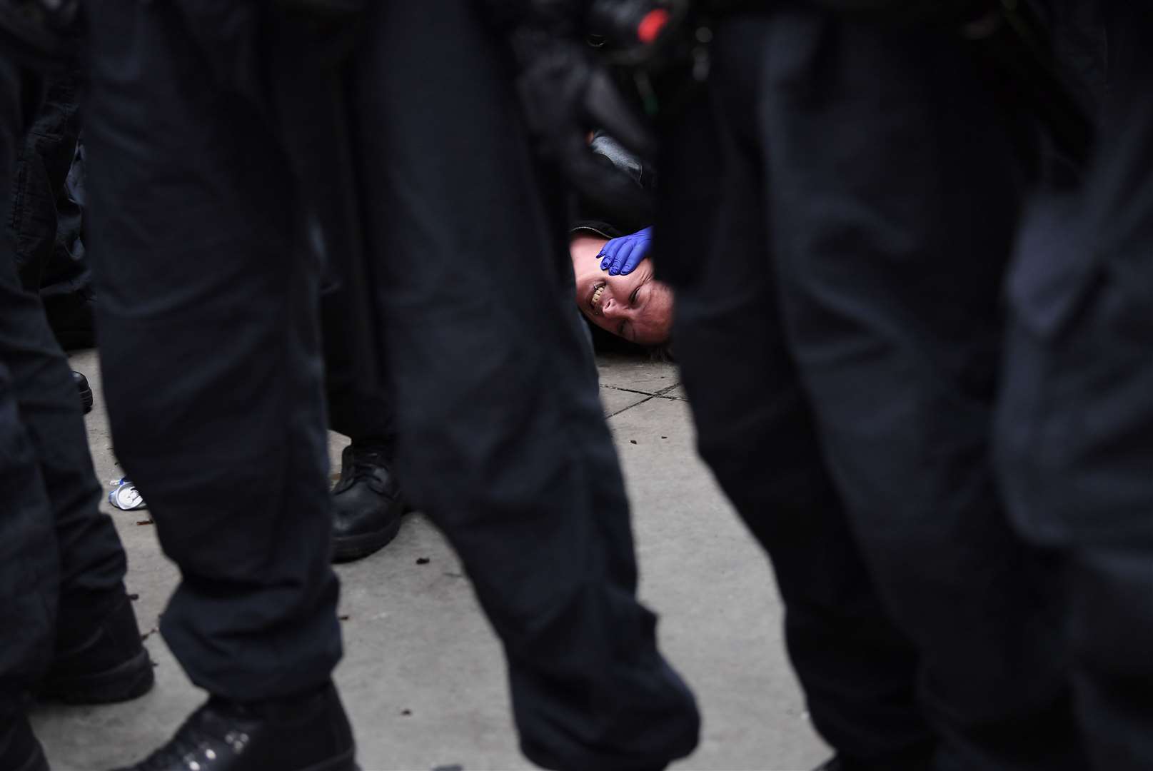 A protester on the ground in Trafalgar Square (Stefan Rousseau/PA)