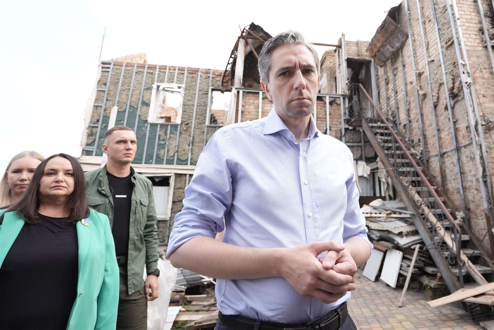 Taoiseach Simon Harris during a visit to inspect a bombed-out house in Hostomel, Ukraine (Stefan Rousseau/PA)