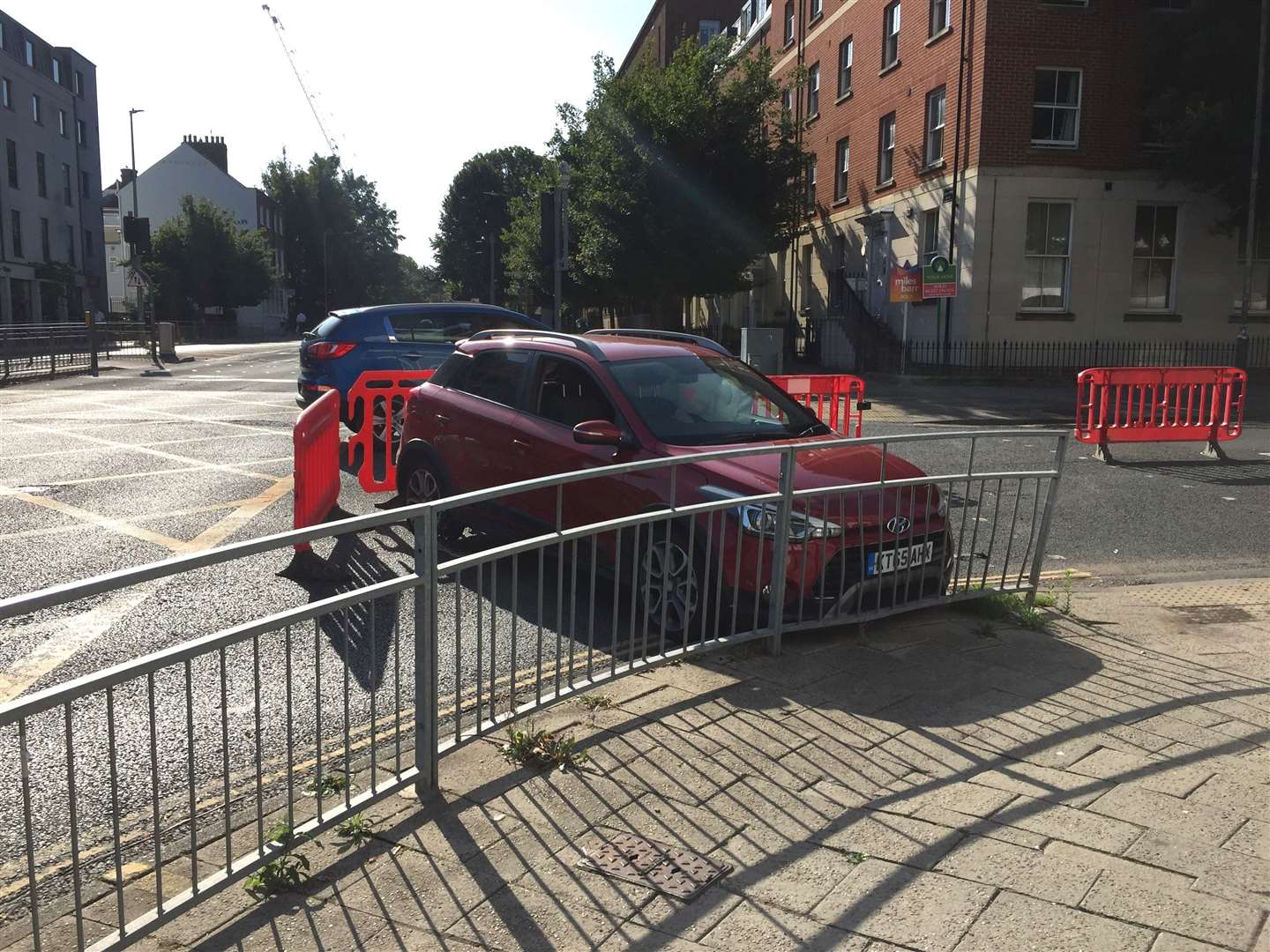 Police are at the scene of a crash involving two cars in Upper Chantry Lane, Canterbury, near the traffic lights by Waitrose and Premier Inn in New Dover Road