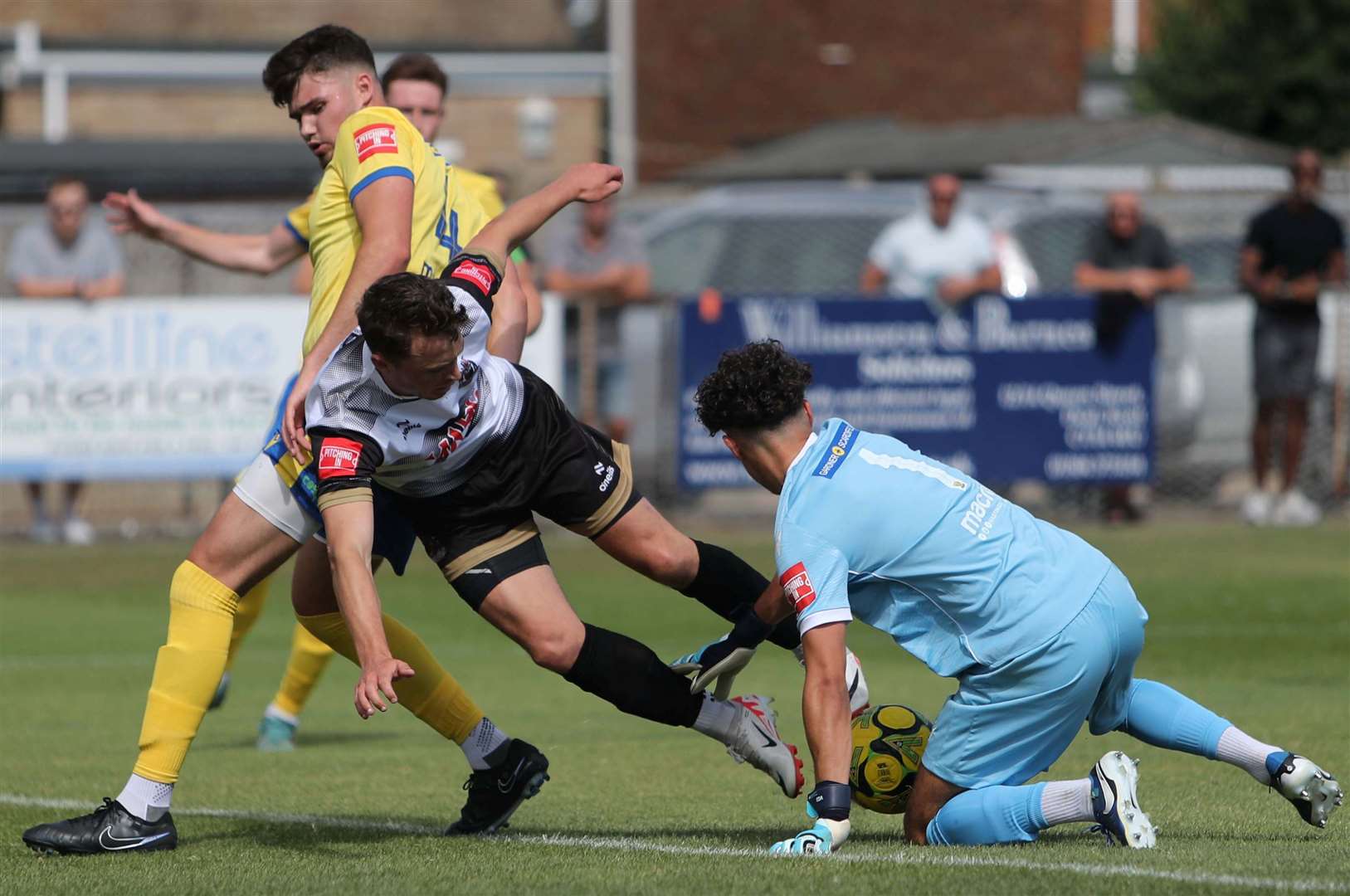 Deal Town's Rory Smith is denied by Lancing keeper Lorenz Ferdinand - the teenage son of former England and Manchester United defender Rio Ferdinand. Picture: Paul Willmott