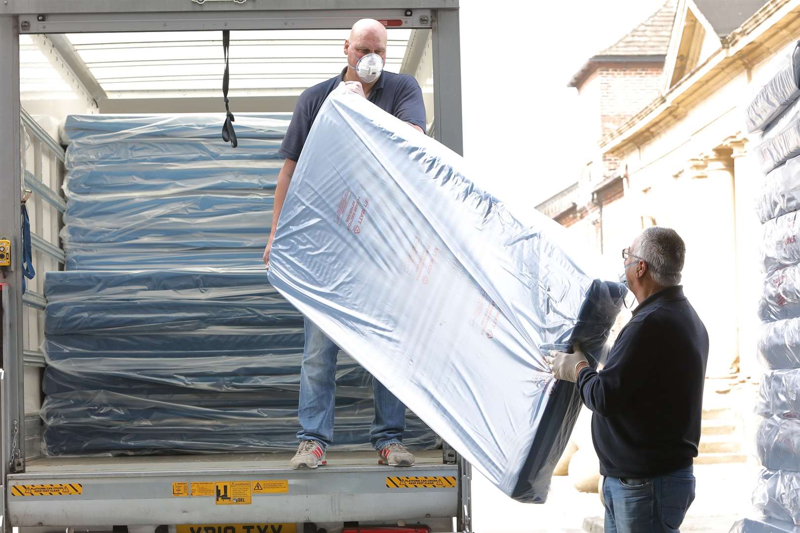 Dave Holdsworth (left) and Keith Aveyard get some mattresses on the road (GNG Group/PA)