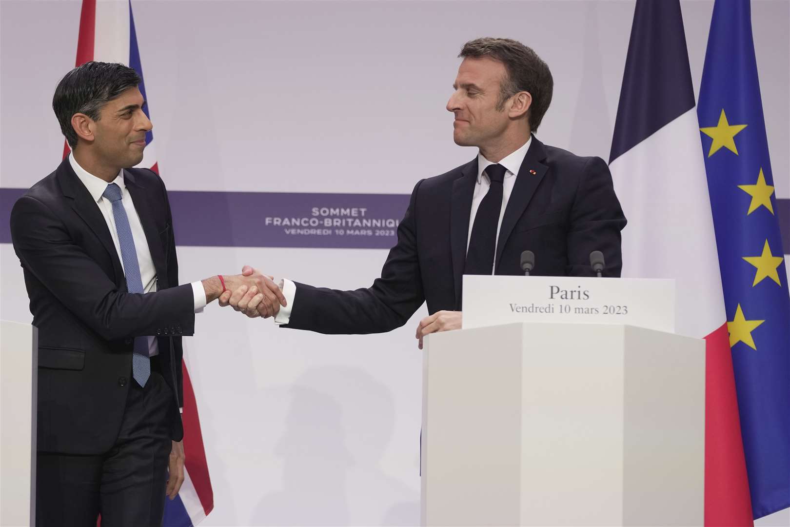 Rishi Sunak and Emmanuel Macron shake hands (Kin Cheung/PA)